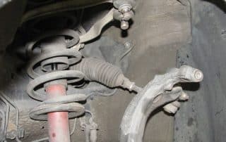 Car suspension system inside wheel well