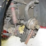 Car suspension and brake assembly with wheel removed